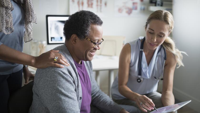 male patient talking with doctor at appointment
