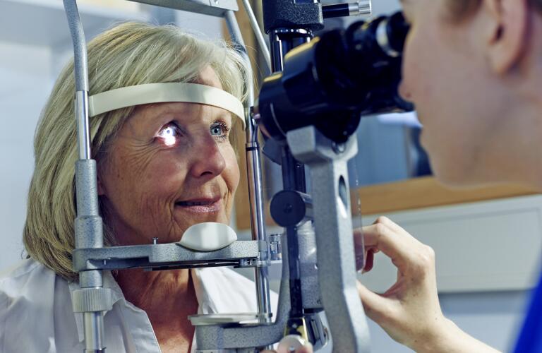 Female patient having eye tested in hospital