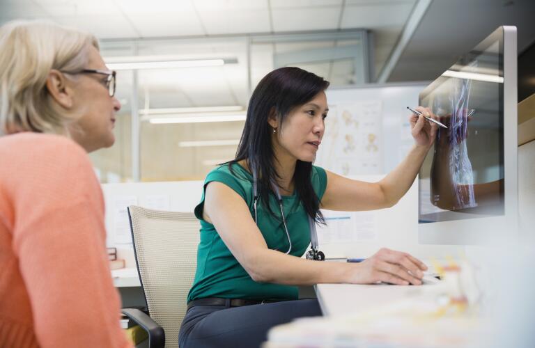 doctor-discussing-x-ray-with-patient