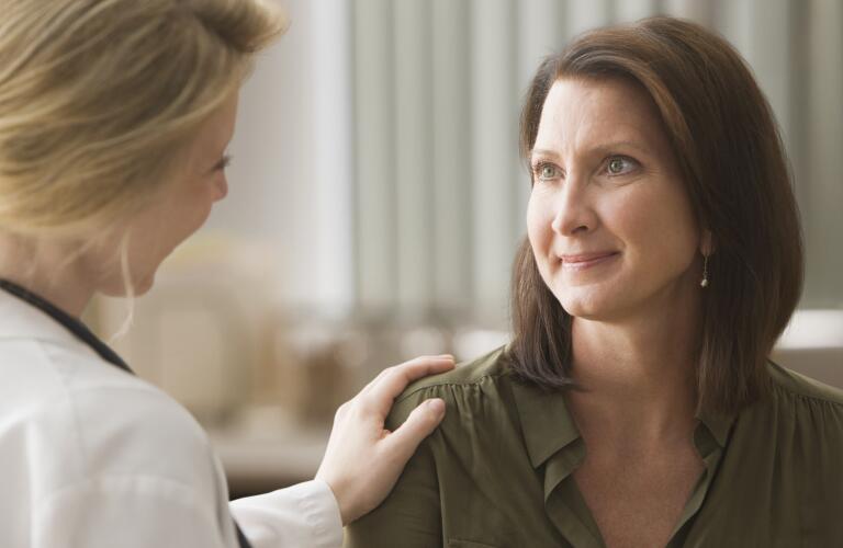 Female doctor talking with patient