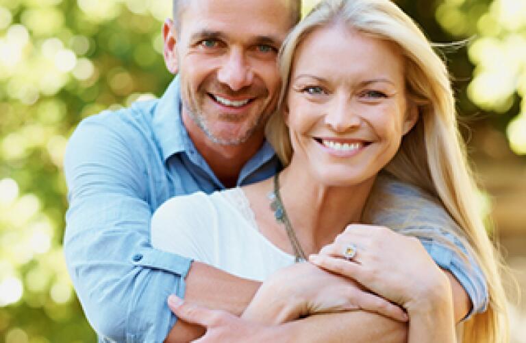 middle aged couple embracing