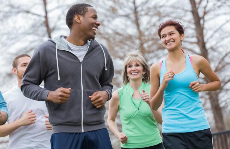 Young couple going for run with running club together
