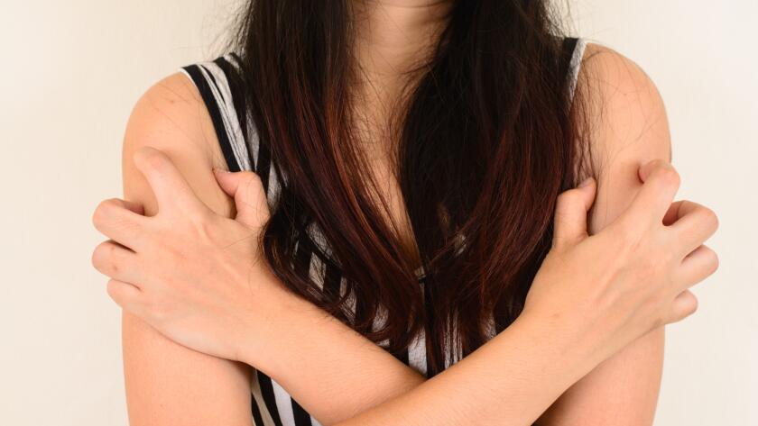 woman-with-hands-over-chest