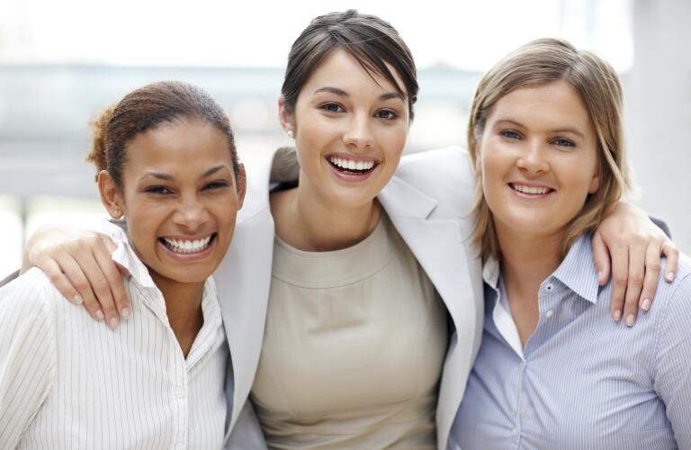 Portrait of smiling business women standing together