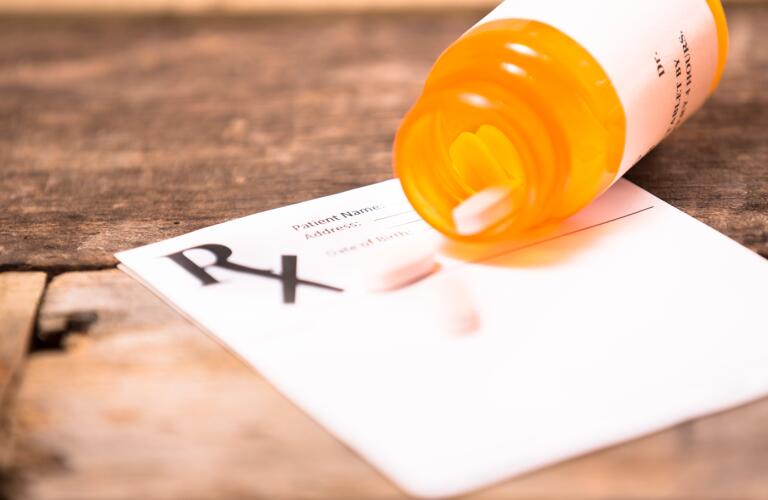Pharmacy-medication-bottle-with-prescription-pad