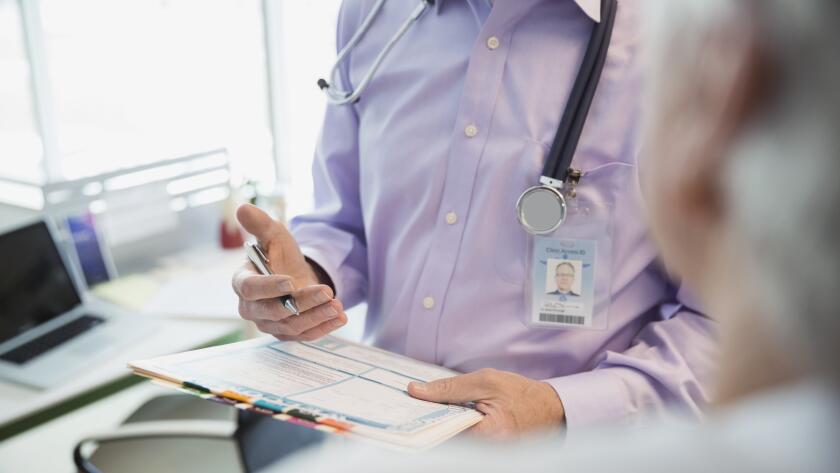 doctor-giving-diagnosis-to-patient
