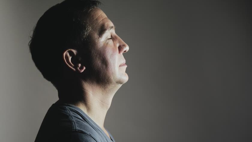 portrait of man with eyes closed