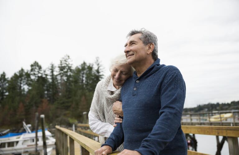 couple-embracing-on-dock