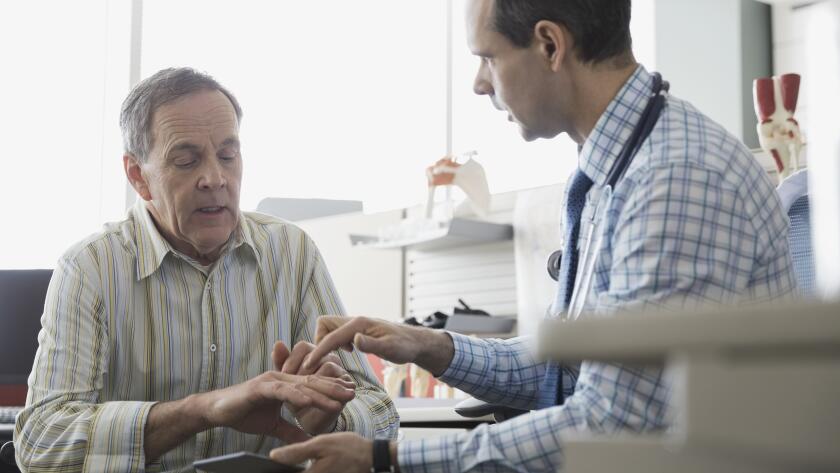 Older patient with doctor