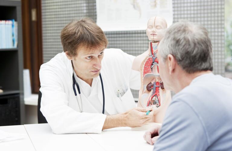 urologist-showing-model-to-patient
