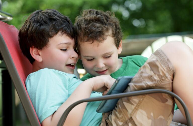 two-boys-using-tablet