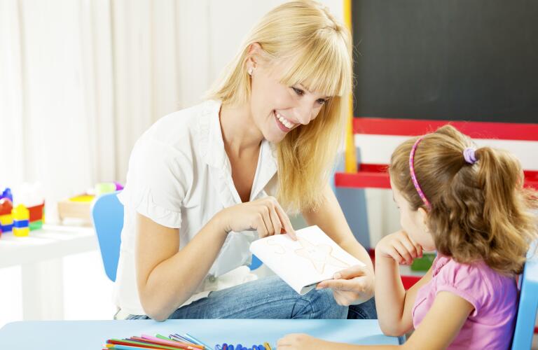 Speech Therapist Talking with Child