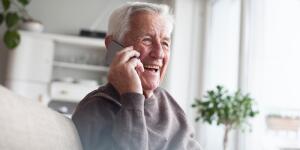 senior-man-telephoning-with-smart-phone-at-home
