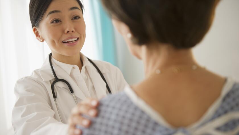 Japanese doctor talking to patient