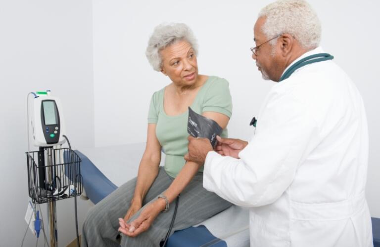 Doctor examining female Senior patient