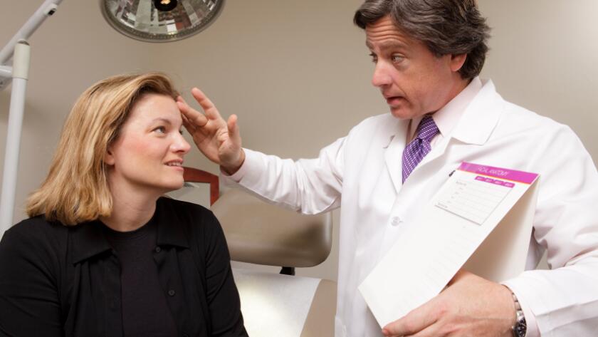 Doctor Consults with Patient