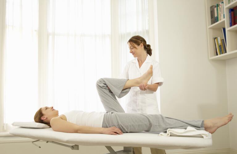 physical-therapist-working-with-client