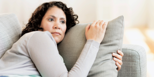 woman laying on couch