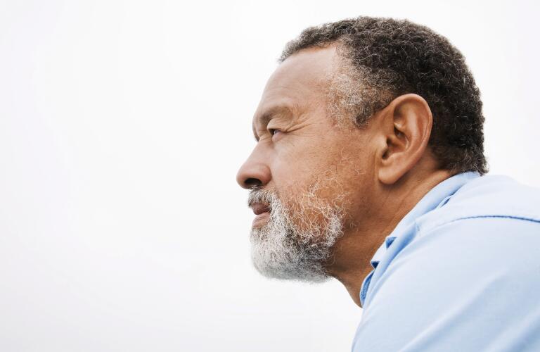 thoughtful African American man gazing into distance