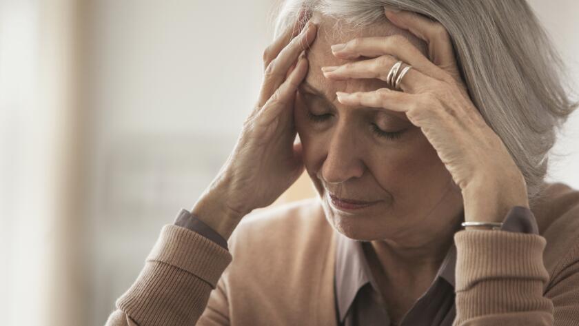 senior-woman-with-hands-on-head