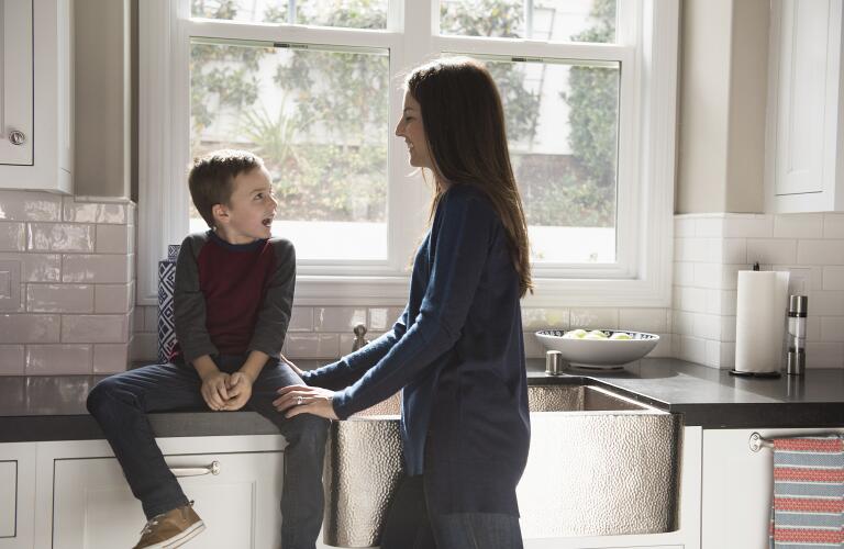 mother-talking-with-son-in-kitchen