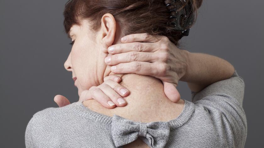 woman-with-hands-on-back-of-neck