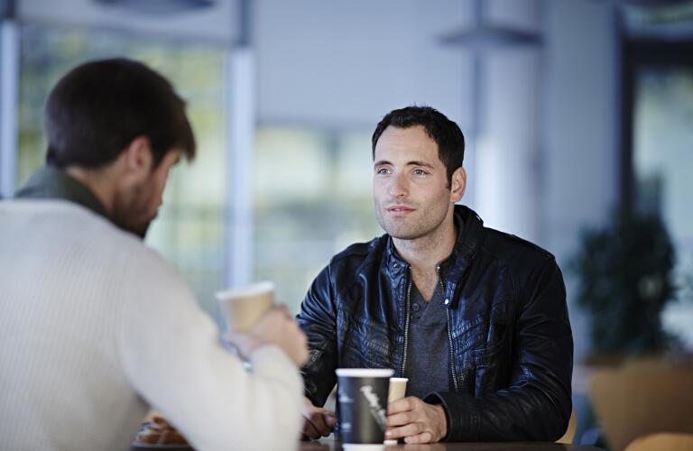 man-having-coffee-with-friend