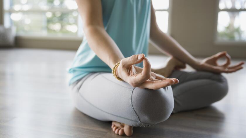 woman-sitting-in-yoga-position