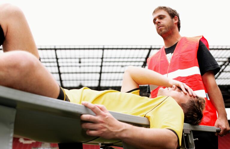 athlete on stretcher