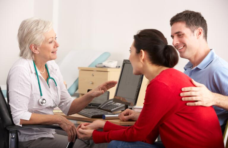couple talking to doctor