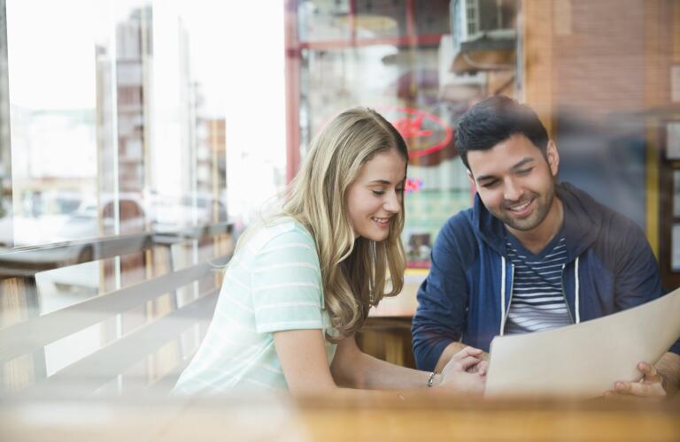couple-looking-at-restaurant-menu