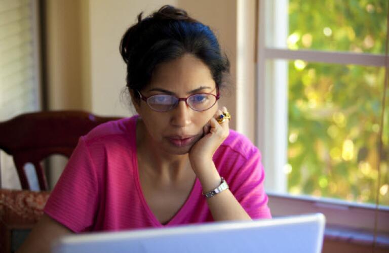 serious woman on laptop