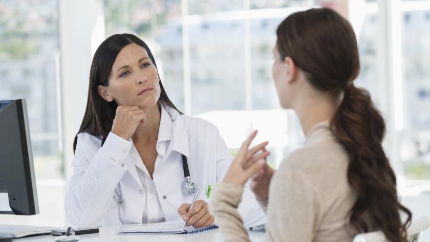 Female doctor discussing with a patient