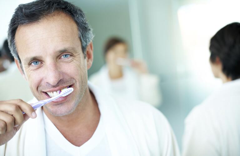 guy brushing teeth