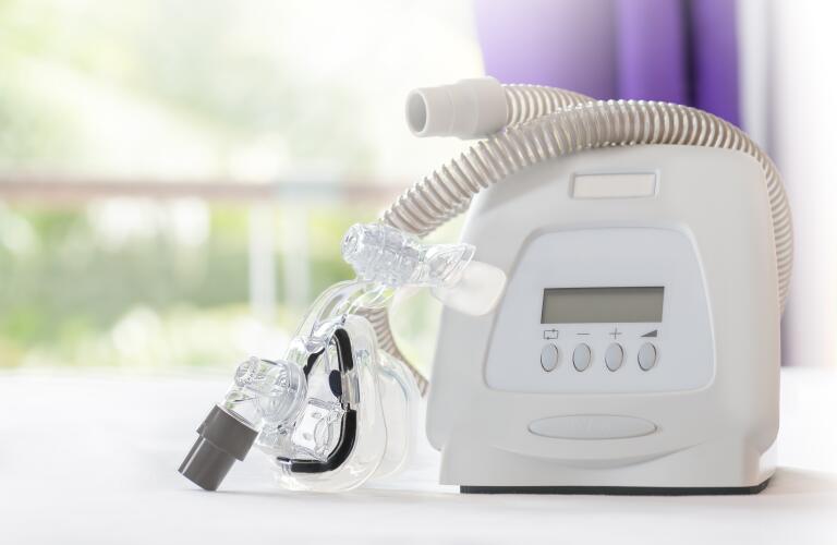 cpap mask and machine on table