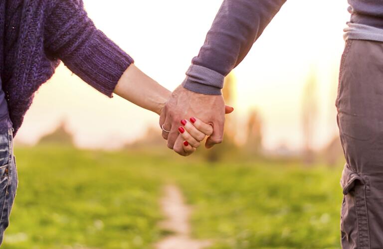 Holding hands, caucasian couple in love