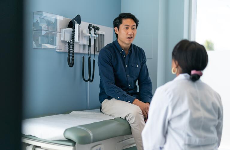 Man talking to doctor