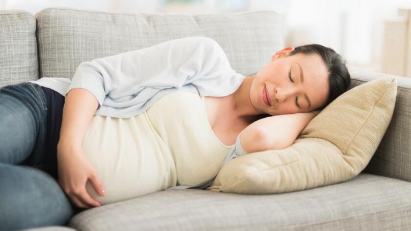 pregnant-woman-taking-nap-on-couch