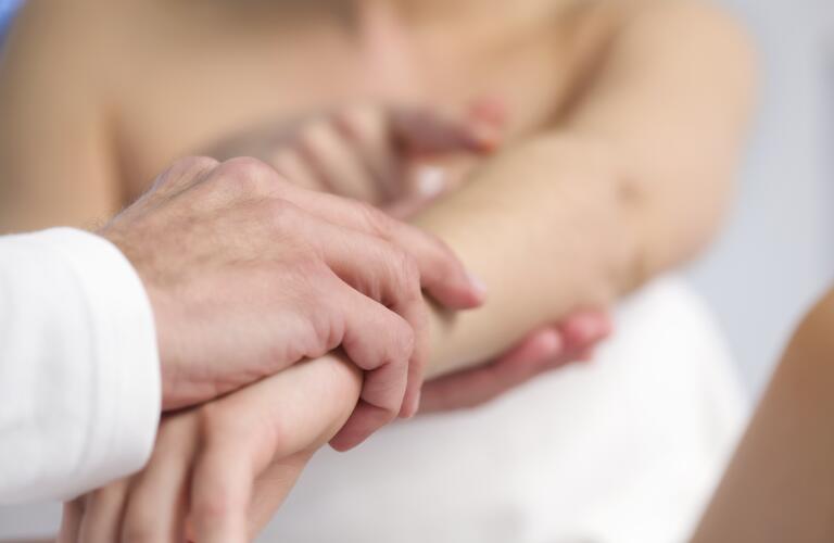 doctor-examining-patients-arm