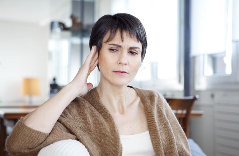 middle aged woman with tinnitus