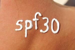 SPF30 written on back in white cream