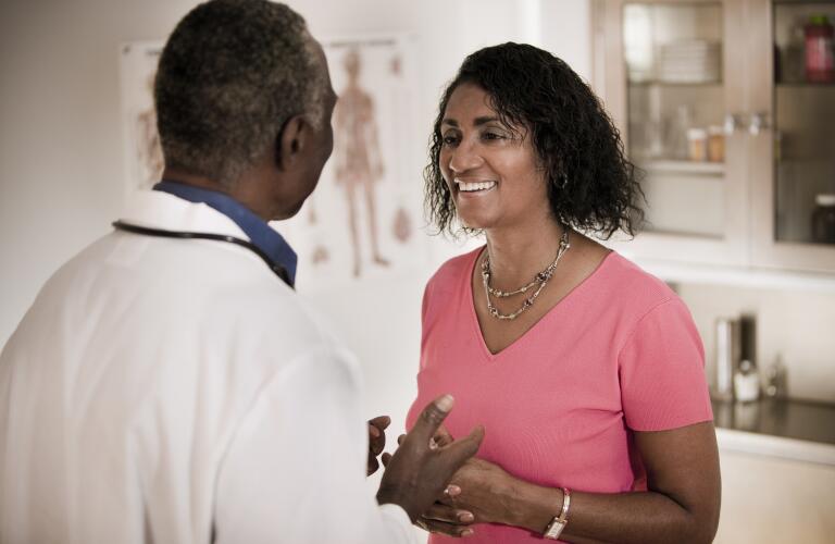 Woman Talking to Doctor