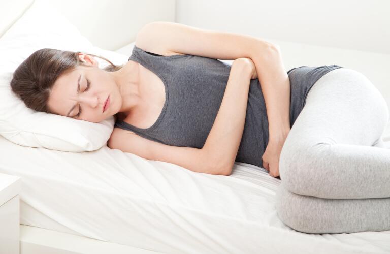 woman with stomach cramps