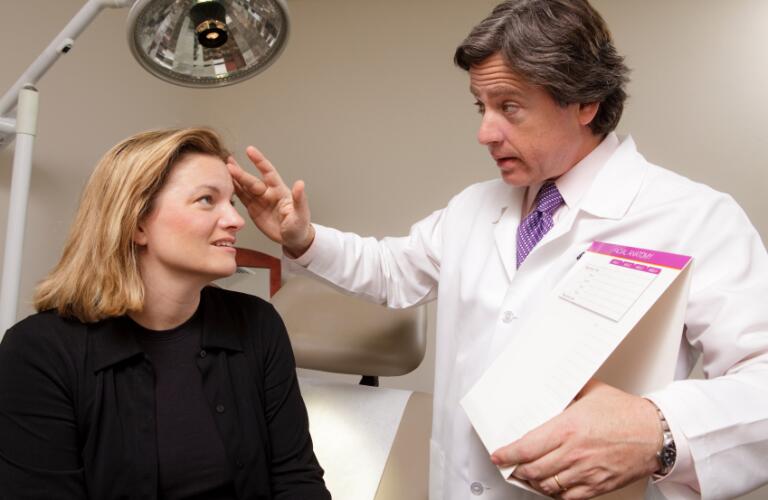 Doctor Consults with Patient