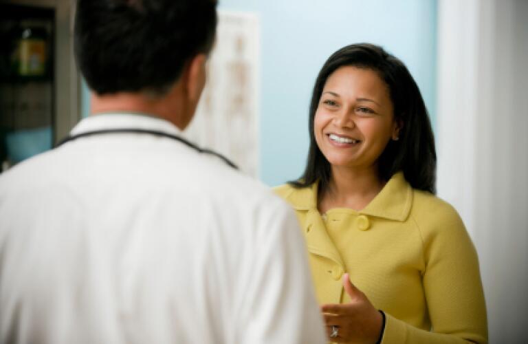 woman talking to doctor