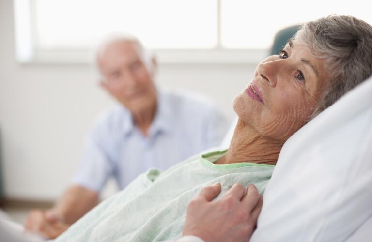 Senior woman in hospital bed