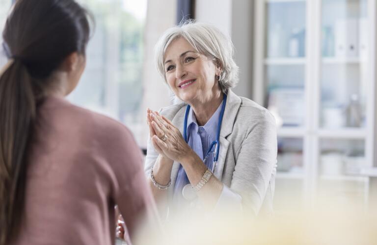 Senior Caucasian female medical doctor consulting patient