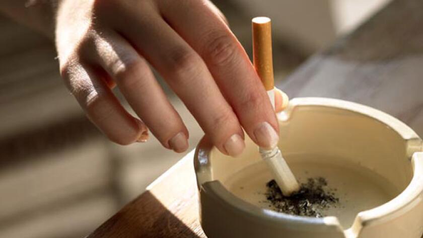 Stubbing out cigarette