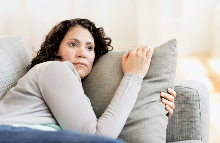 woman laying on couch