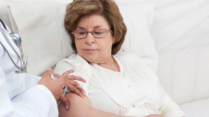 patient receiving injection in arm